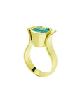 This yellow gold solitaire emerald ring for women displays the top setting and band ring profile.