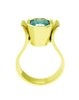 The lateral position of this 14k yellow gold emerald solitaire ring shows the bezel setting and band of the ring.