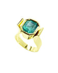 2.14 ct. rectangular emerald-cut Colombian emerald solitaire ring bezel set in 14K yellow gold.