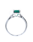 Colombian emerald solitaire silver ring with a square emerald cut gemstone in a four-prong setting.