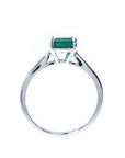 Colombian emerald solitaire silver ring with a square emerald cut gemstone in a four-prong setting.