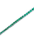 Natural Colombian emeralds tennis bracelet, round cut, prong set in 14K gold.