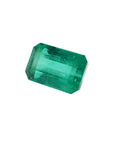 Emerald-cut natural loose colombian emerald, left side table and crown visibles