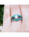 14k white gold ring enhancer with 0.76 ct. emeralds, designed to frame a pear-shaped solitaire.