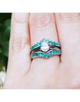 14k white gold ring enhancer with 0.76 ct. emeralds, designed to frame a pear-shaped solitaire.