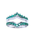 This enhancer emerald ring displays the topside detailed two rows of natural emeralds round cut.