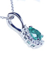 This enhancer emerald pendant is showing the downside gallery profile view.