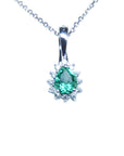 A pear shaped emerald enhancer pendant necklace displaying its topside view.