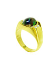 Men's 14K yellow gold ring with a large oval Ethiopian black opal and two small side diamonds.