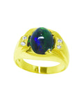 Gold ring with a central oval black opal and smaller diamonds on a top and sides profile view.