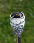 Men's sterling silver ring with a fiery red, green, and blue Ethiopian black opal.