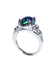 Silver ring with a central Ethiopian black opal gemstone on a half lateral profile view.