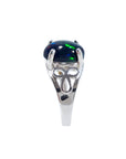 A silver ring with a black Ethiopian opal gemstone on a side profile view.