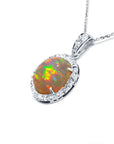 Ethiopian Welo opal pendant with red flashes, diamond halo, and 14K white gold chain.