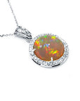 Round Ethiopian Welo opal pendant with red flashes, diamond halo, and 14K white gold chain.