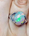 Ethiopian opal sterling silver ring for women, oval cut, with red and orange play of color.
