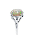 Ethiopian opal sterling silver ring for women with an oval cut, showing red, orange, and green play of color.