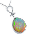 7.76 ct. Ethiopian Welo Opal and Diamond Pendant in 14K White Gold, featuring a pear-shaped opal with multicolor shimmer.