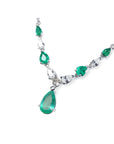 14k white gold necklace with pear-shaped emeralds and diamonds.