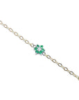 14K yellow gold chain bracelet with a central emerald and diamond flower cluster.