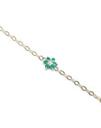 14K yellow gold chain bracelet with a central emerald and diamond flower cluster.