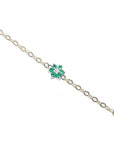 14K yellow gold chain bracelet with a central emerald and diamond flower cluster.