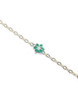 14K yellow gold chain bracelet with a central emerald and diamond flower cluster.