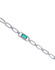 14K white gold paper clip bracelet with a rectangular emerald haloed by diamonds.