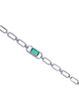 14K white gold paper clip bracelet with a rectangular emerald haloed by diamonds.