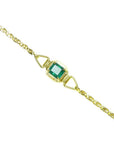 14K yellow gold solitaire bracelet with a deep green Colombian emerald.