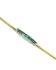 2.40 ct emerald and diamond 14K yellow gold bracelet with a central bar of baguette emeralds.