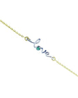 14K white and yellow gold "Love" bracelet with a round cut green emerald.