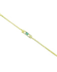 14K yellow gold bracelet with a rectangular Colombian emerald surrounded by diamonds.