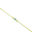 14K yellow gold bracelet with a rectangular Colombian emerald surrounded by diamonds.