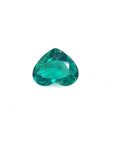 1.14 carat heart-cut Colombian emerald with a rich bluish-green color on a white background.