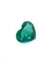 1.14 carat heart cut Colombian emerald with a rich bluish-green color on a white background.