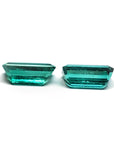 Two sparkling, emerald-cut natural emeralds in a medium deep bluish-green hue, perfect for earrings.