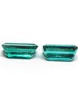 Two sparkling, emerald-cut natural emeralds in a medium deep bluish-green hue, perfect for earrings.