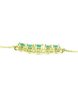 Sparkling 14K gold necklace with five round-cut medium light green Colombian emeralds.