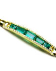 18k gold bracelet with five high qualities natural colombian emeralds and side accent diamonds.