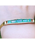 A five stone emerald bracelet natural Colombian emeralds fine quality made of 18k yellow gold for women.