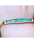 A five stone emerald bracelet natural Colombian emeralds fine quality made of 18k yellow gold for women.