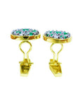 The lateral view of a pair of yellow gold cufflinks with natural emeralds and diamonds.