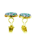 Men's gold cufflinks with oval tops featuring natural emeralds and diamonds.