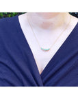 Green Fire Emerald Necklace with five sparkling round cut emeralds on a 14K gold chain.