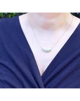 Green Fire Emerald Necklace with five sparkling round cut emeralds on a 14K gold chain.