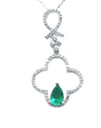 A four-leaf diamond pendant necklace with a central teardrop natural colombian emerald stone.