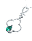 A four-leaf clover emerald pendant crafted in white fold with diamonds.
