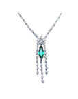 Marquise cut Colombian emerald necklace in 14K white gold with diamond links and dangling diamond accents.