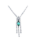 Marquise cut Colombian emerald necklace in 14K white gold with diamond links and dangling diamond accents.